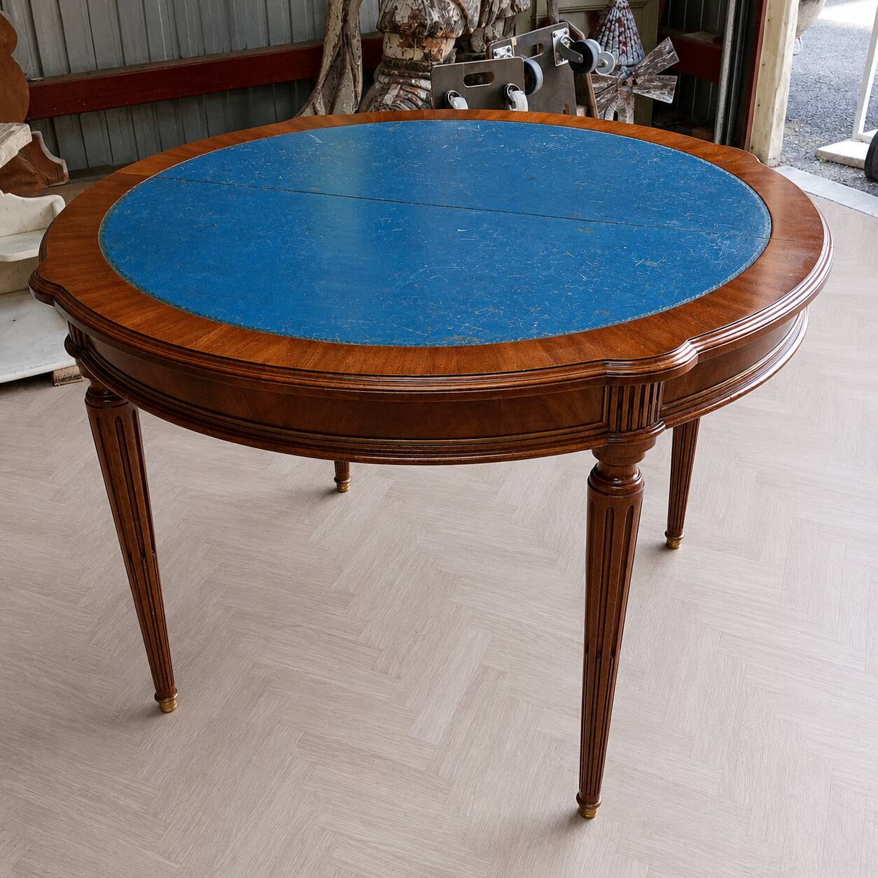 Elegant game table or circular extending side table in Louis XVI style.
