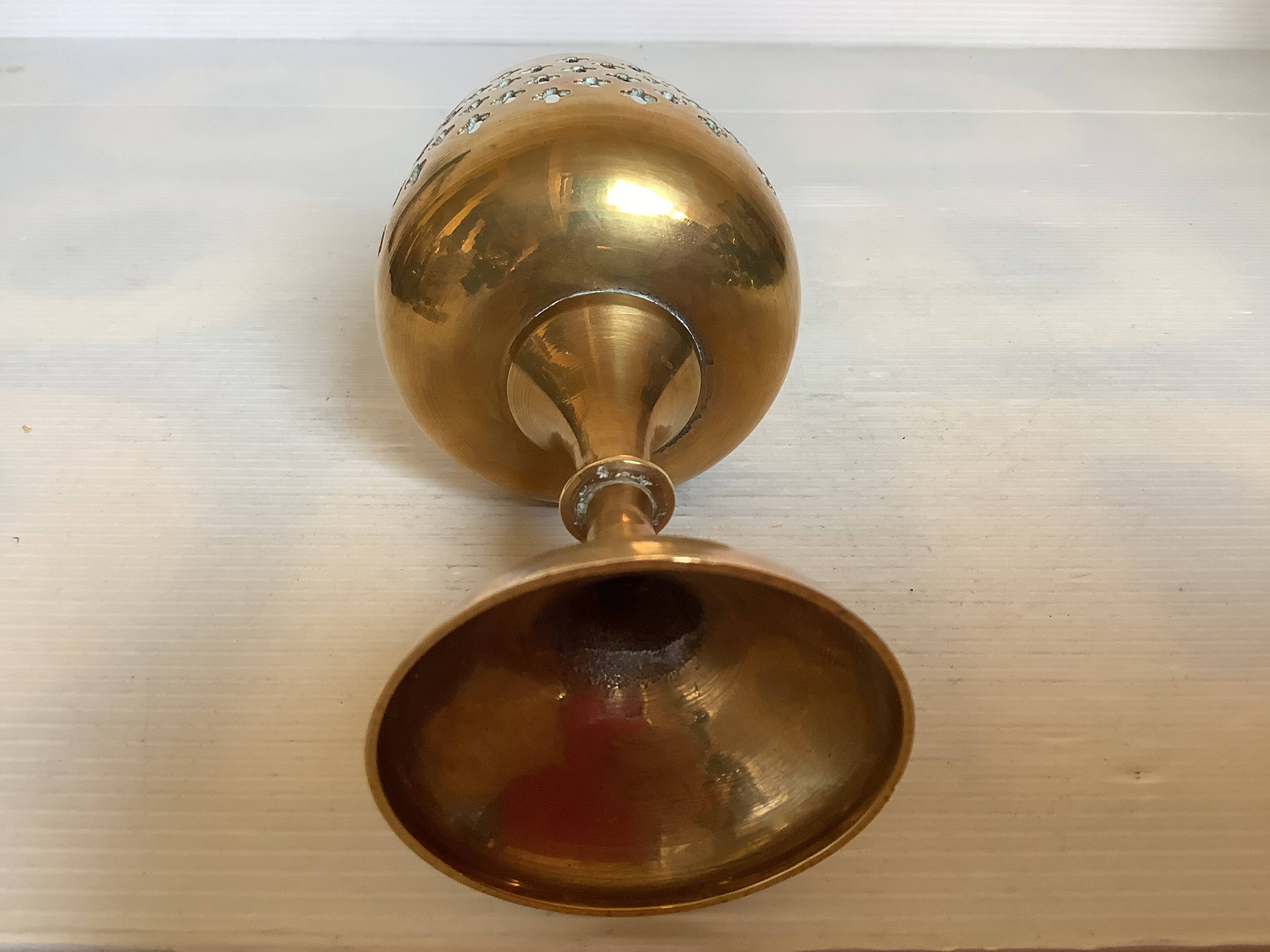 Lattice brass catchall and candlestick.