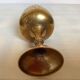 Lattice brass catchall and candlestick.