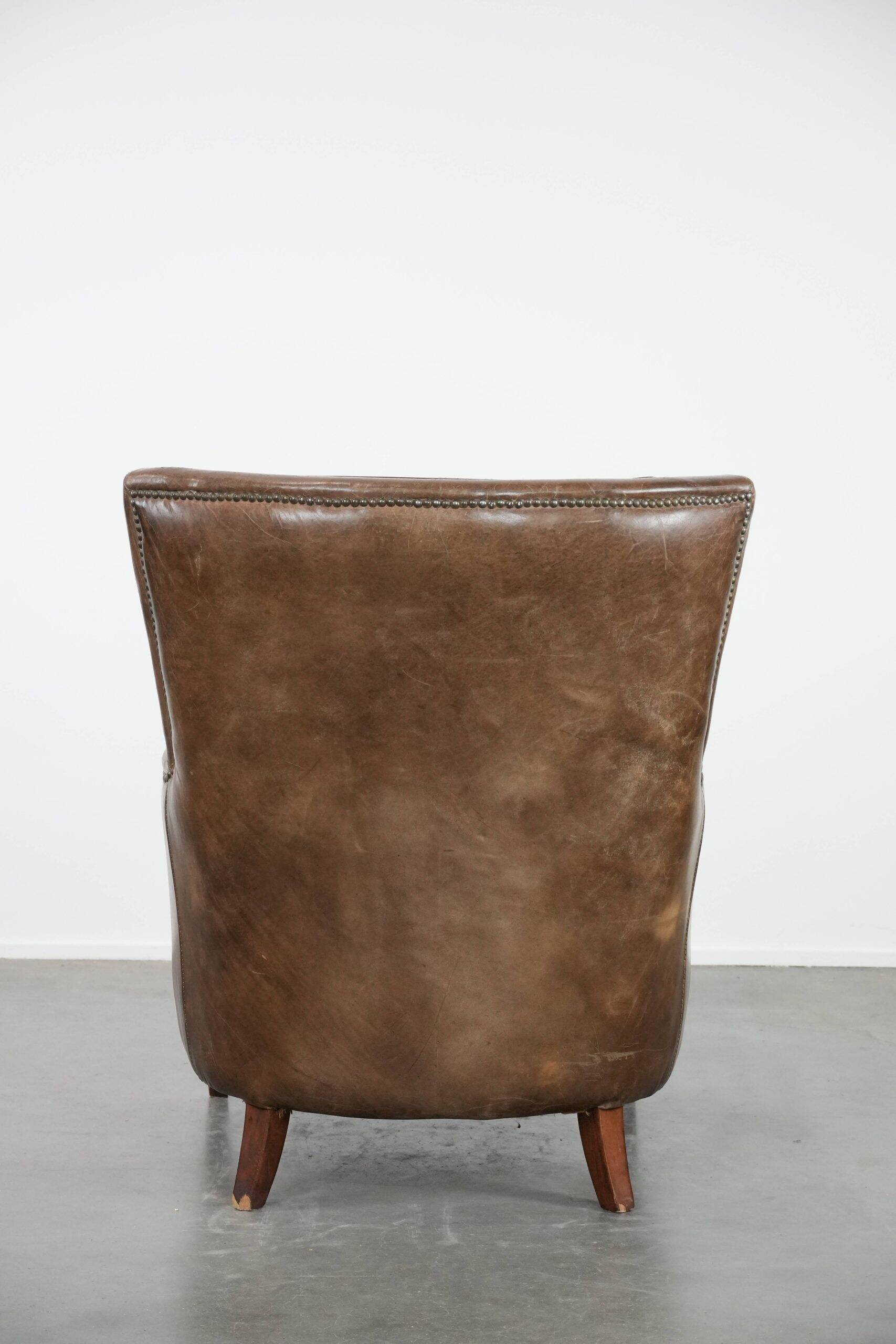 Very comfortable vintage cow leather armchair with beautiful colours
