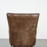 Very comfortable vintage cow leather armchair with beautiful colours