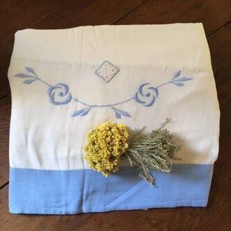 Embroidered cotton linen sheet with blue border
