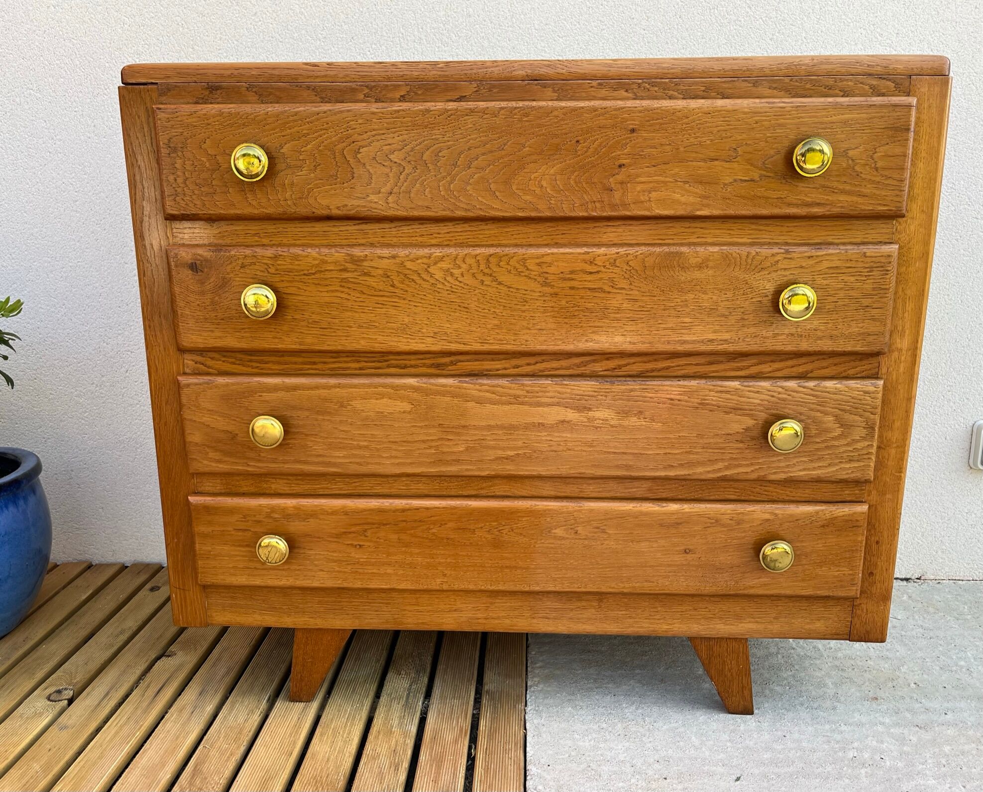 Oak art deco chest of drawers, compass legs