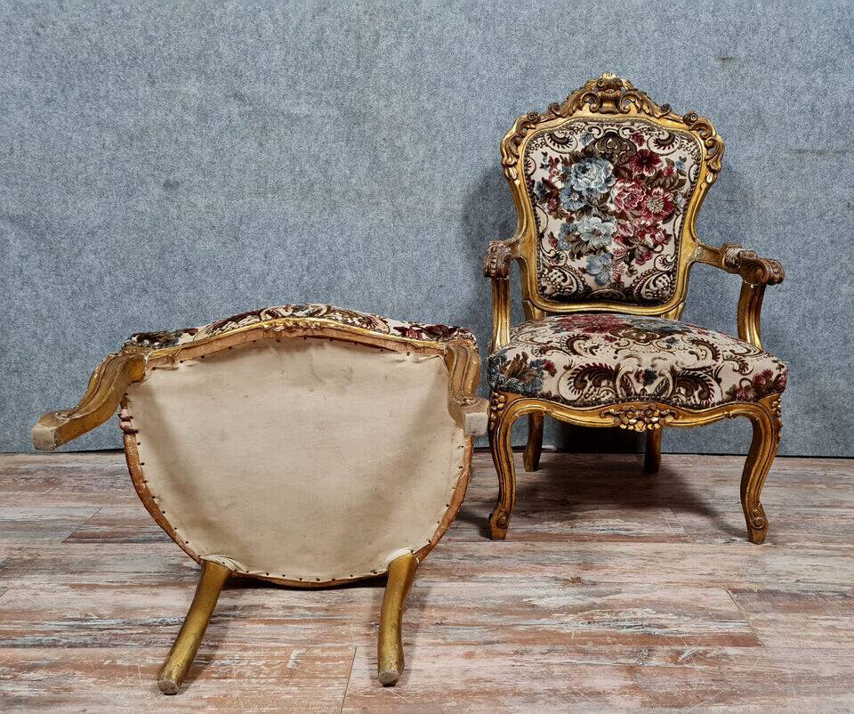 Pair of Louis XV style Baroque armchairs in gilded and carved wood circa 1900