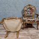 Pair of Louis XV style Baroque armchairs in gilded and carved wood circa 1900