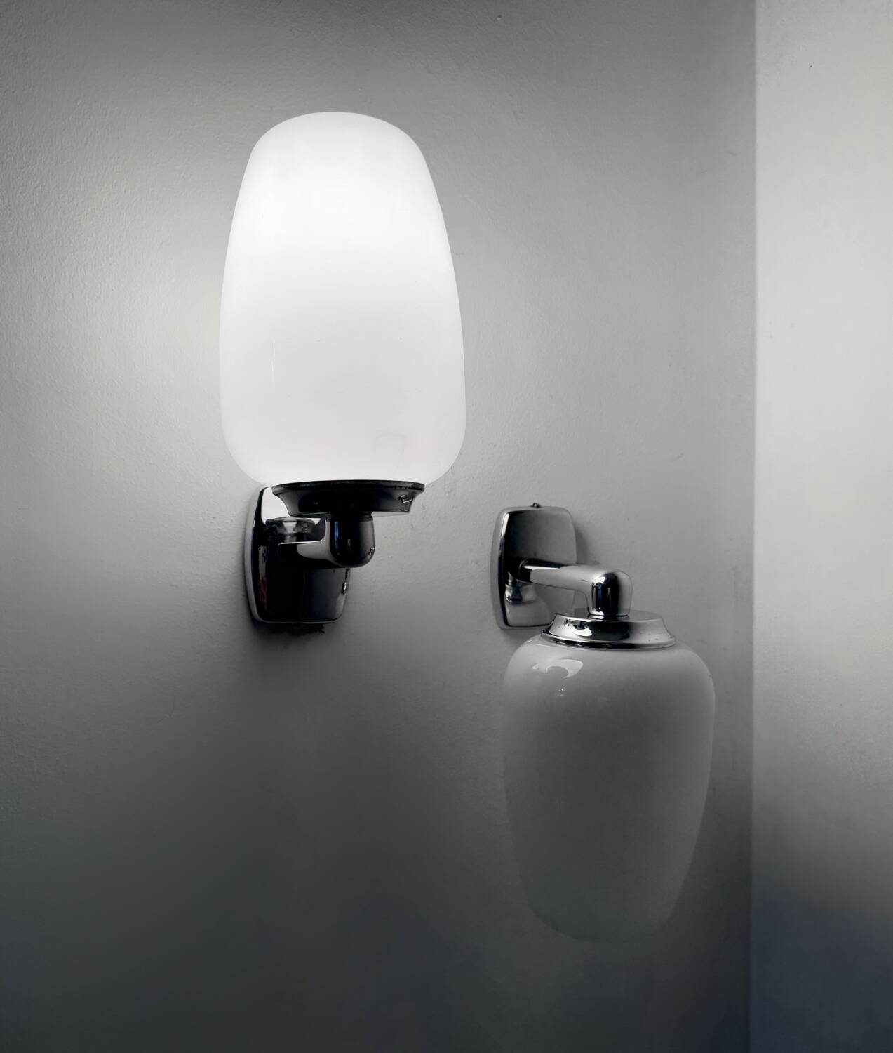 Chrome and opaline wall lights from the 70s.