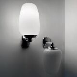 Chrome and opaline wall lights from the 70s.