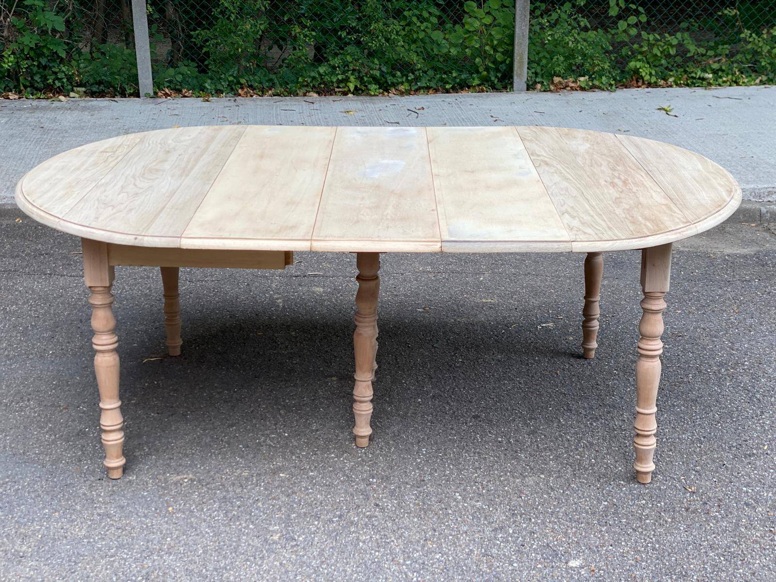 Renovated Louis Philippe round extendable dining table with flaps and 3 extensions.