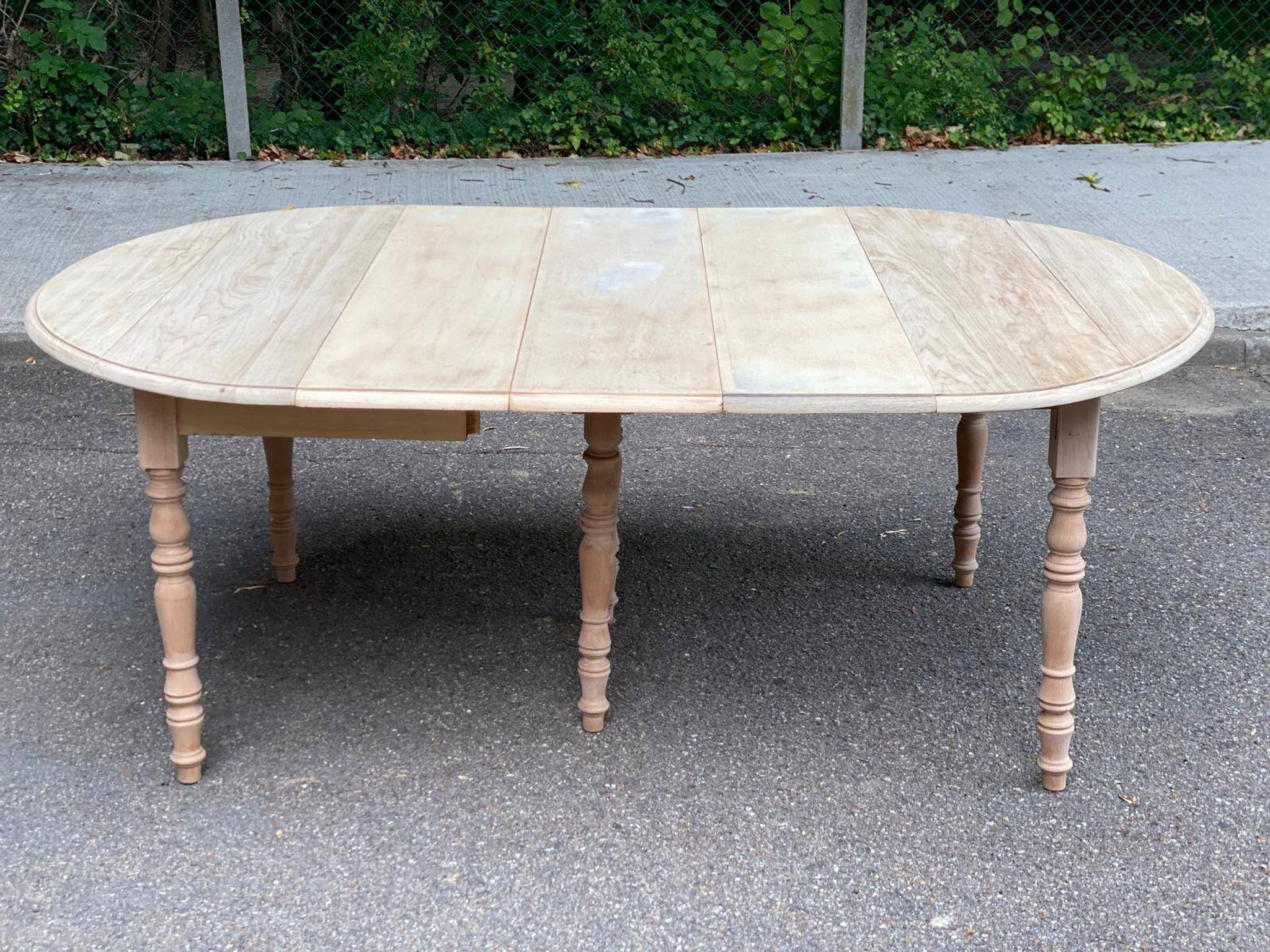 Renovated Louis Philippe round extendable dining table with flaps and 3 extensions.