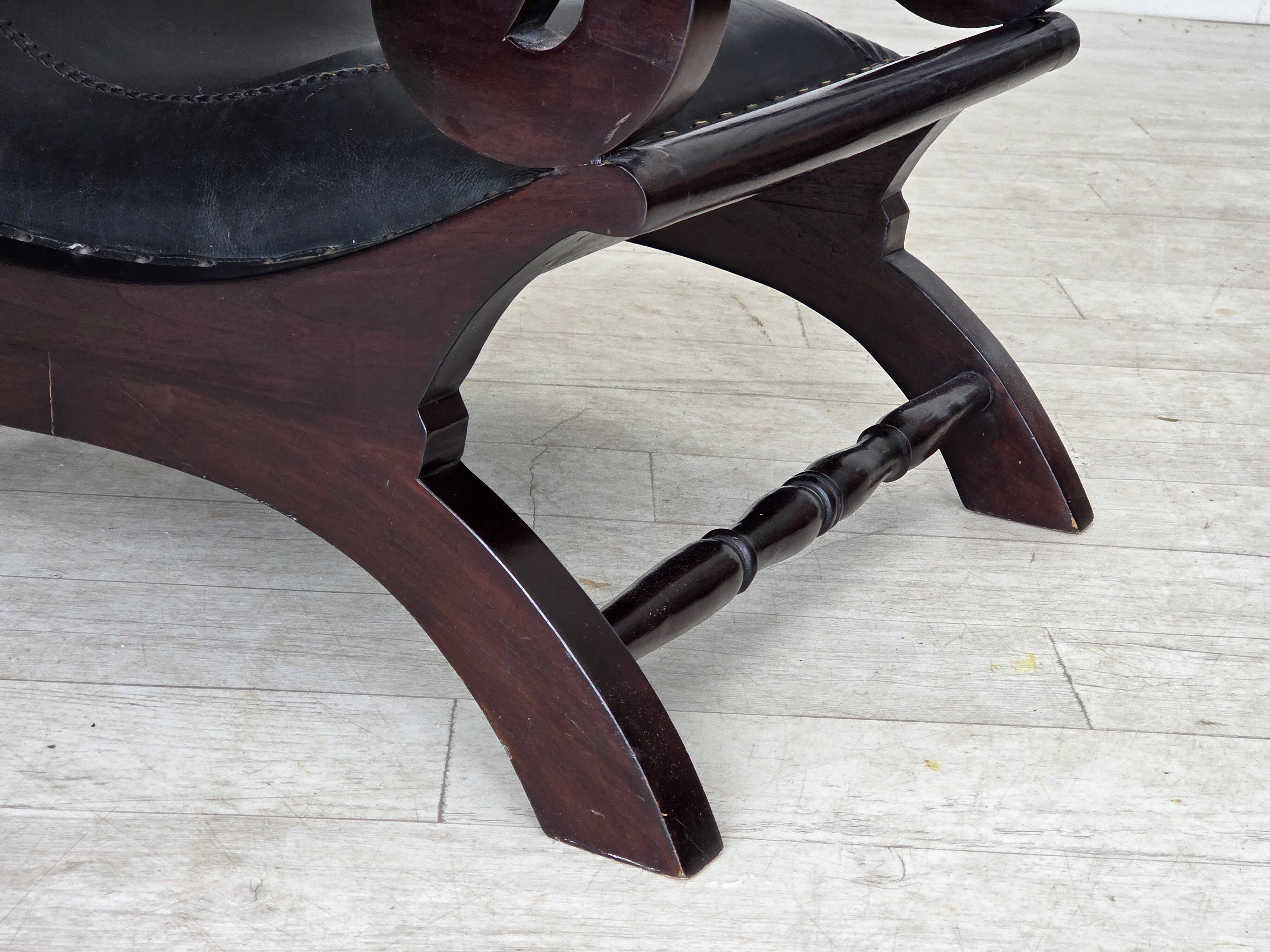 1970s, vintage armchair with footstool, black furniture leather.