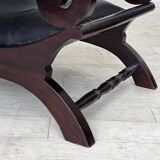 1970s, vintage armchair with footstool, black furniture leather.