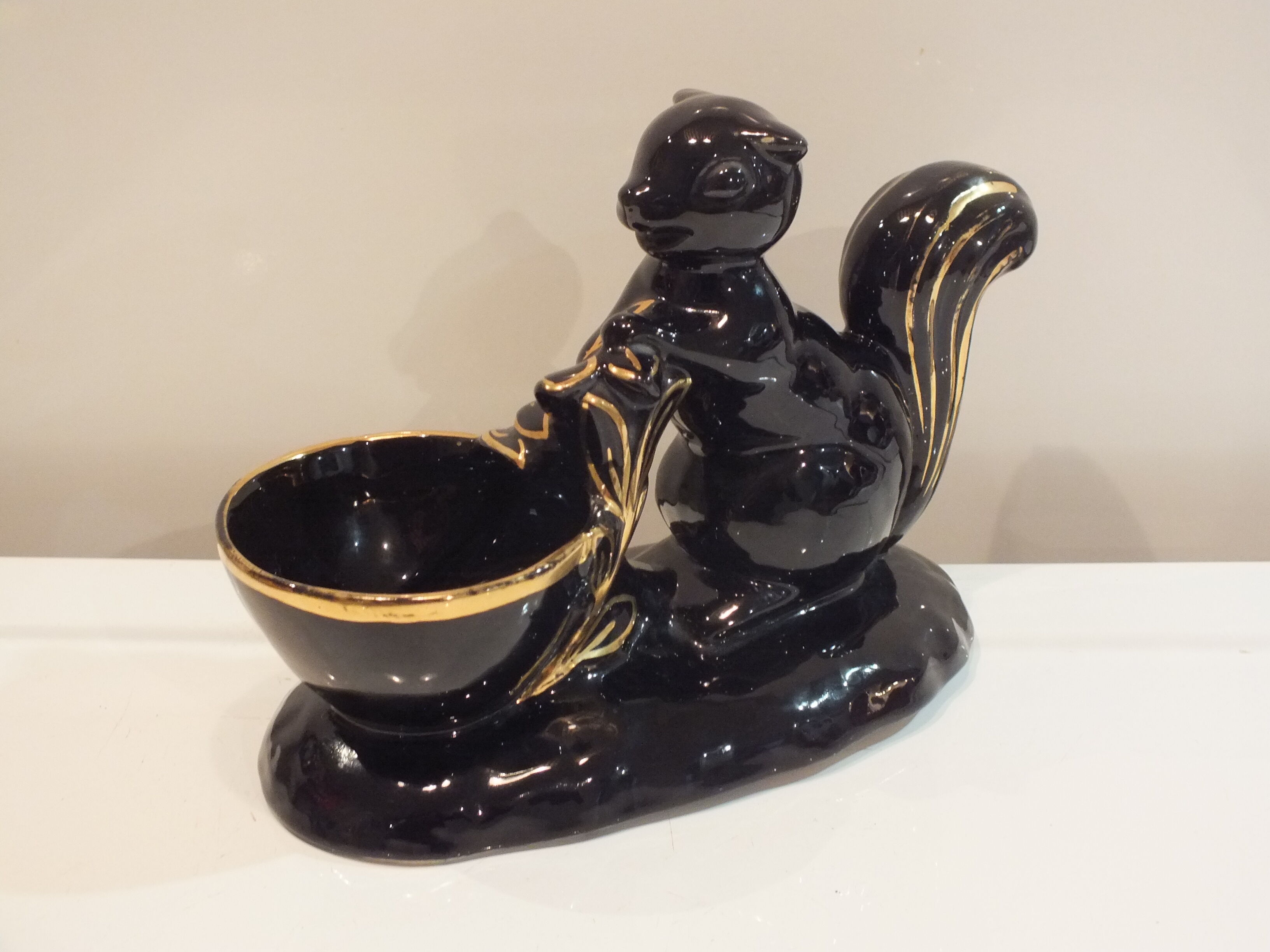 Black and gold ceramic squirrel pot cache from the 50s