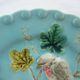 Blue barbotine plate of Sarreguemines: Birds pecking at yellow grapes
