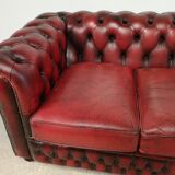 Three-seater red leather chesterfield sofa