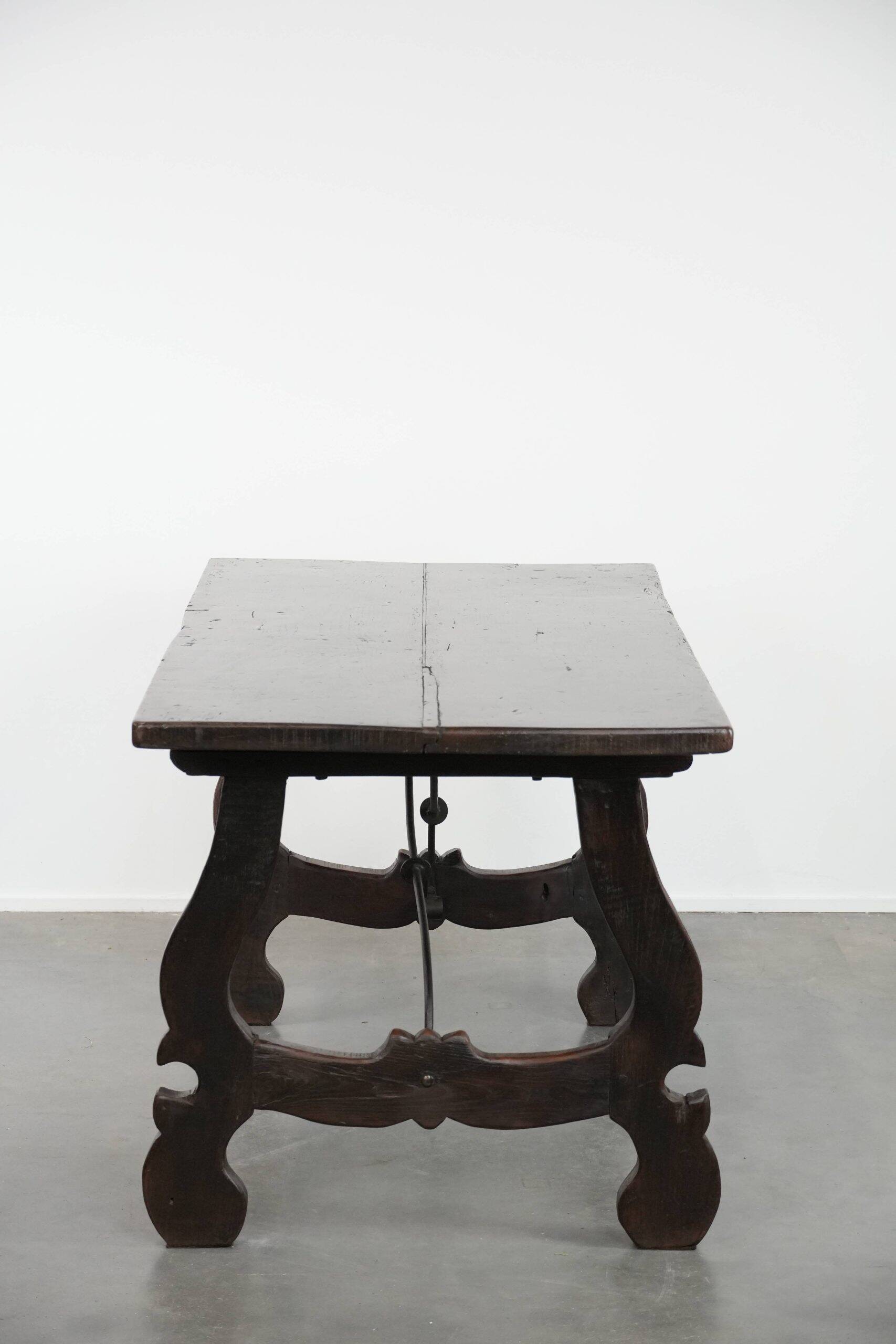 Antique Spanish table from the early 18th century with  a cast iron base