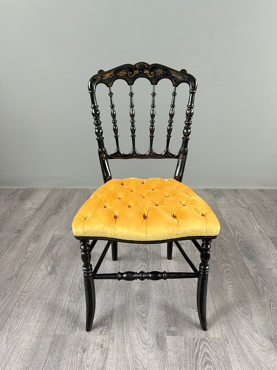 Set of four Napoleon III chairs in blackened wood, 19th century.