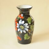 Vintage black ceramic vase with painted floral decoration – stylised colourful flowers.