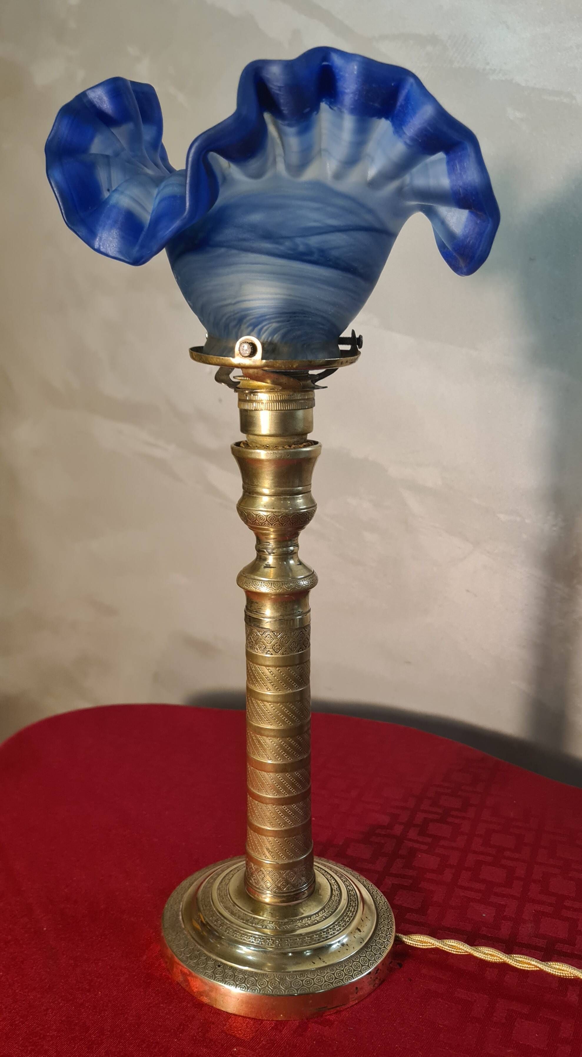 etched brass lamp with a blue satin glass tulip shade, signed Vianne 36x16