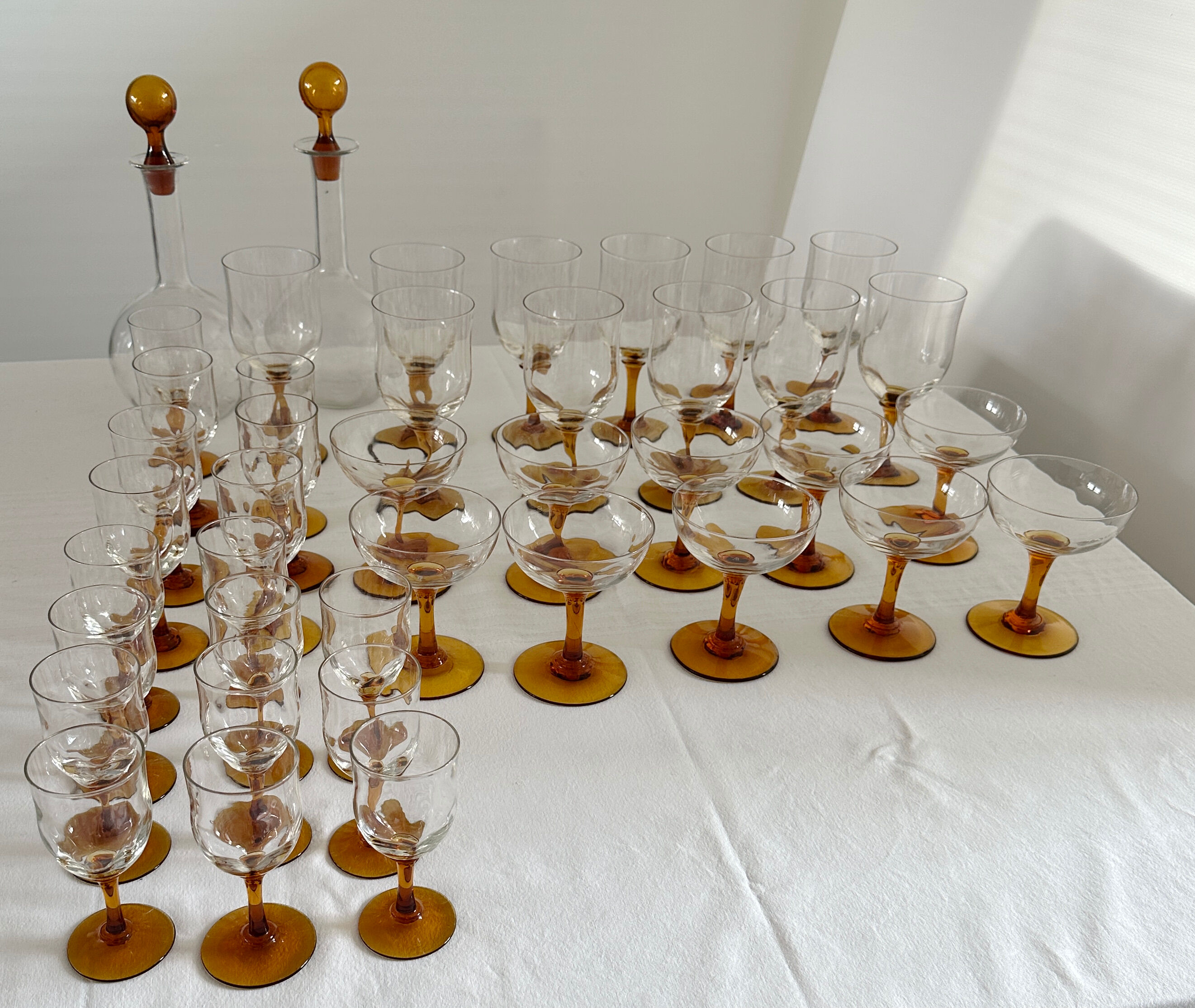 Set of 41 antique glasses with amber stems - water, wine, liqueur, champagne cups.