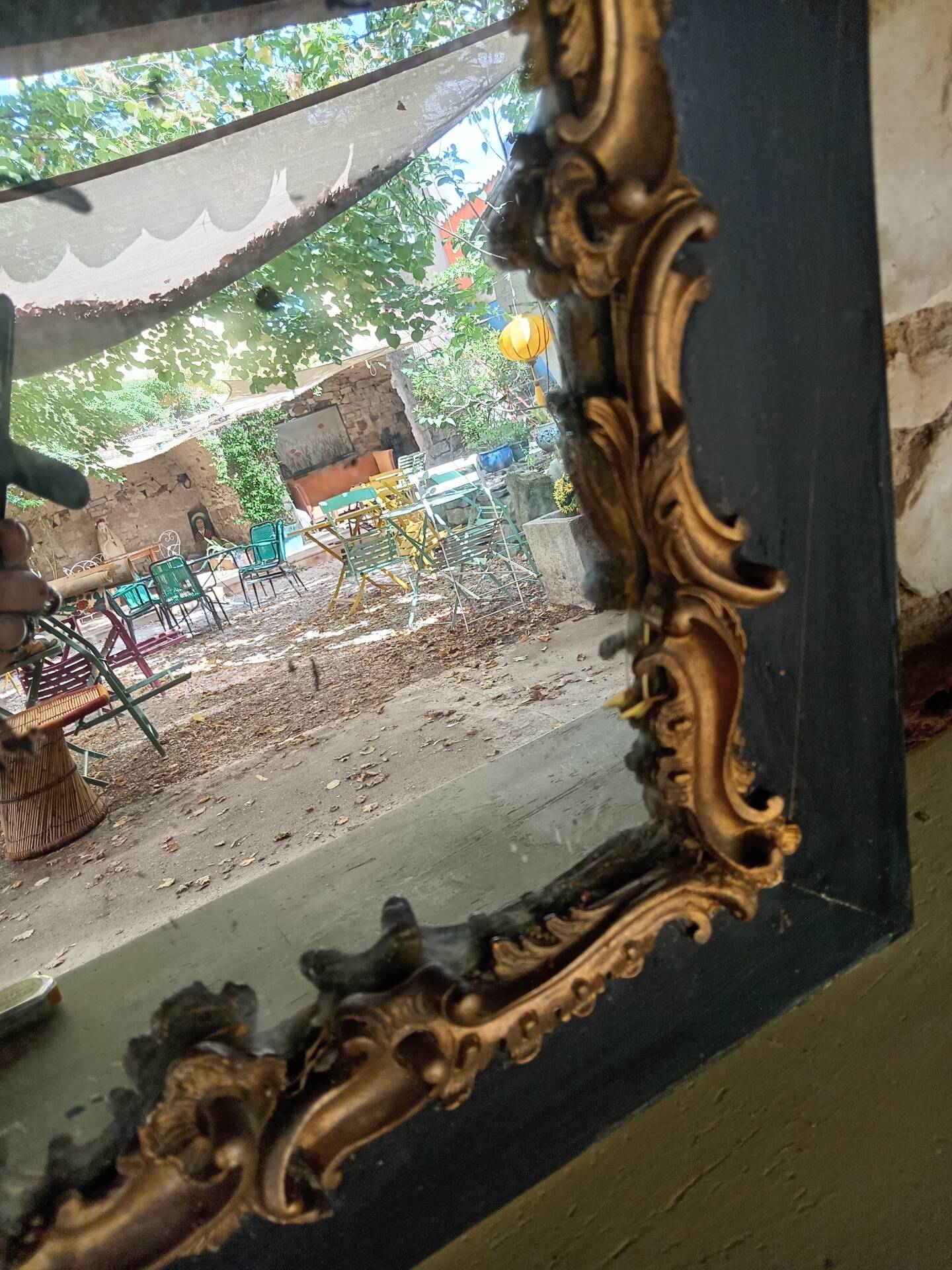 Antique mirror in stucco and wood