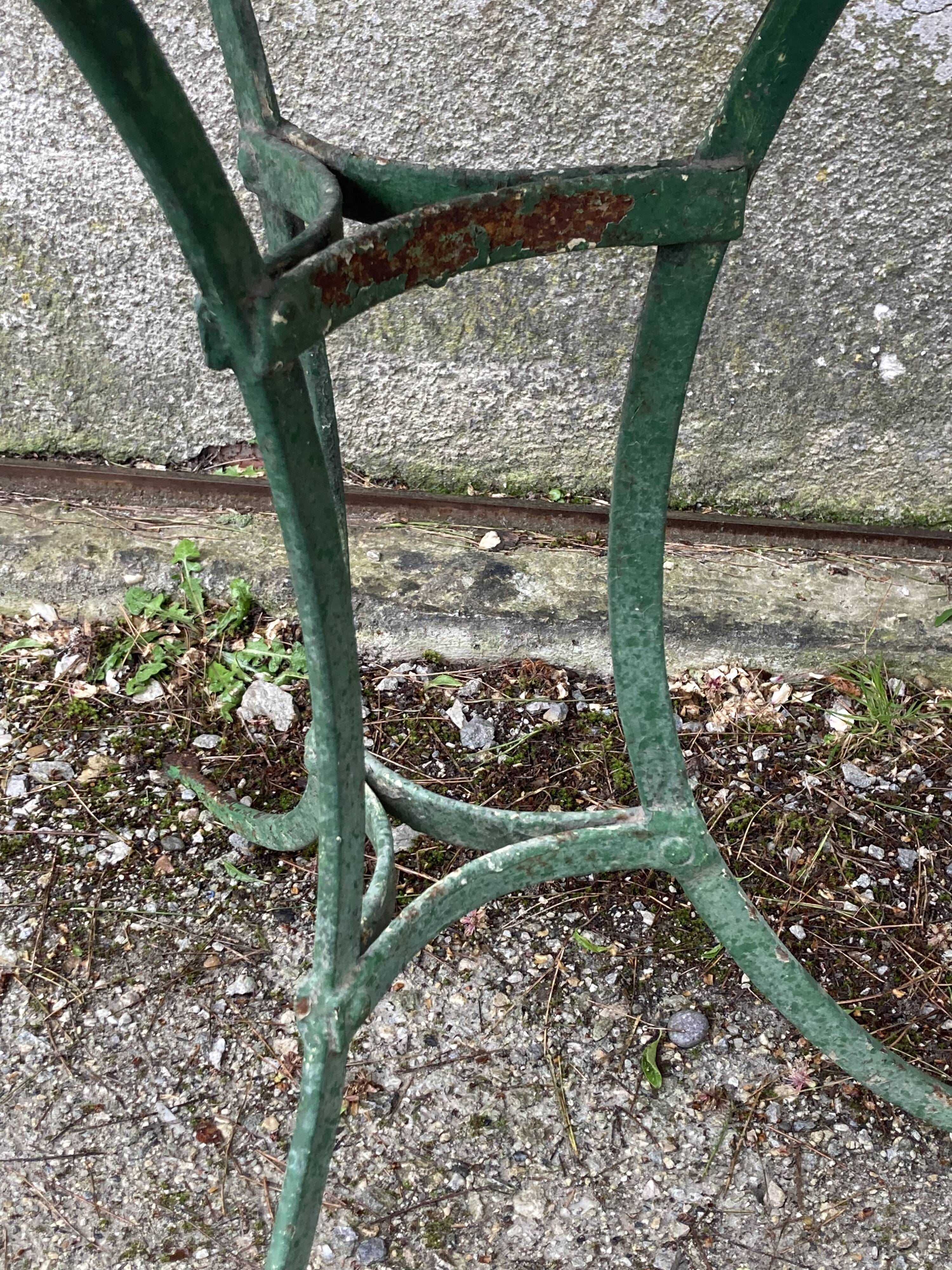 Riveted green old garden pedestal table