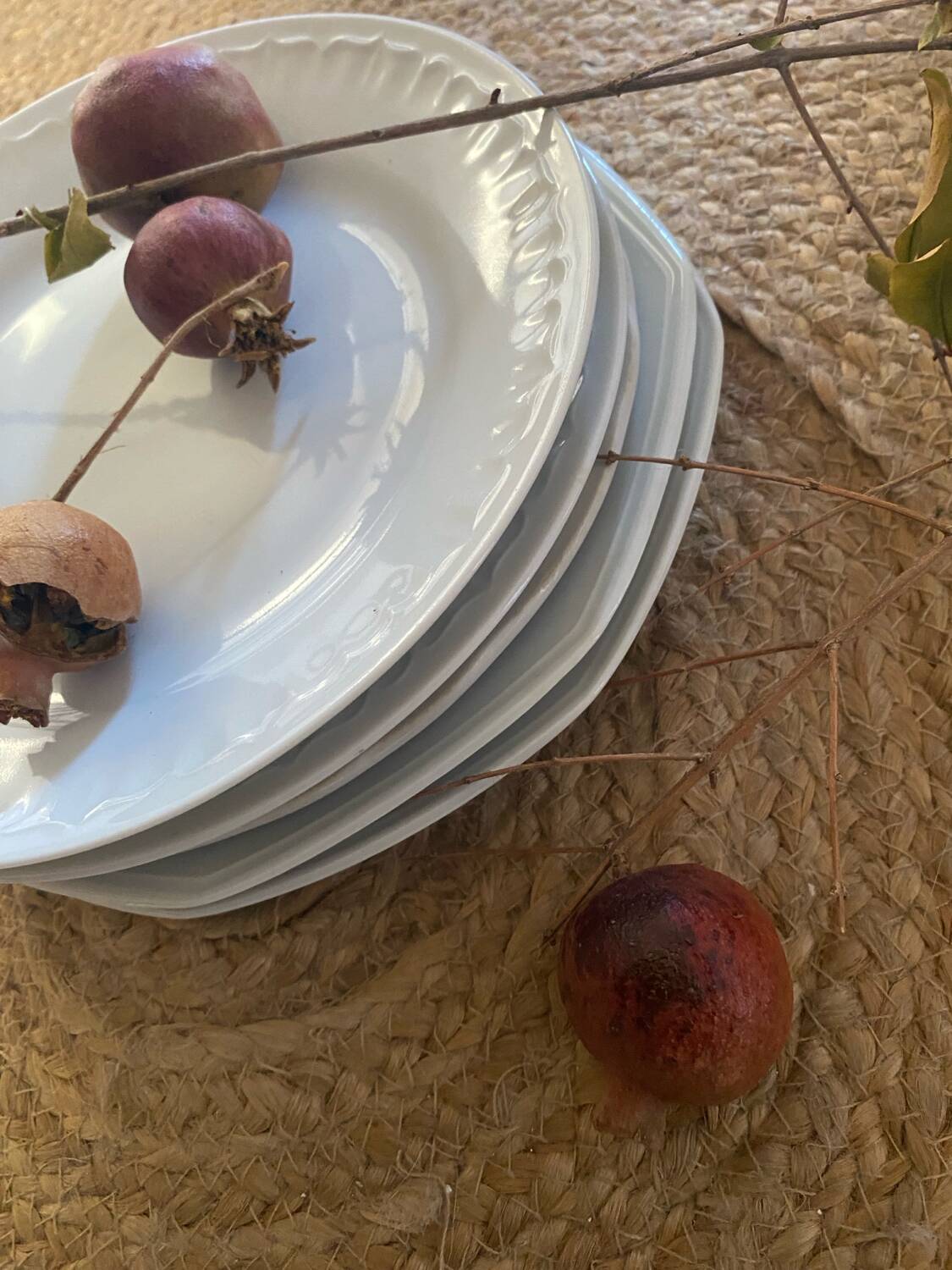 5 mismatched old white plates.