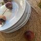 5 mismatched old white plates.