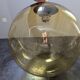 Old large and imposing thick glass globe with a bubbled amber colour, vintage.
