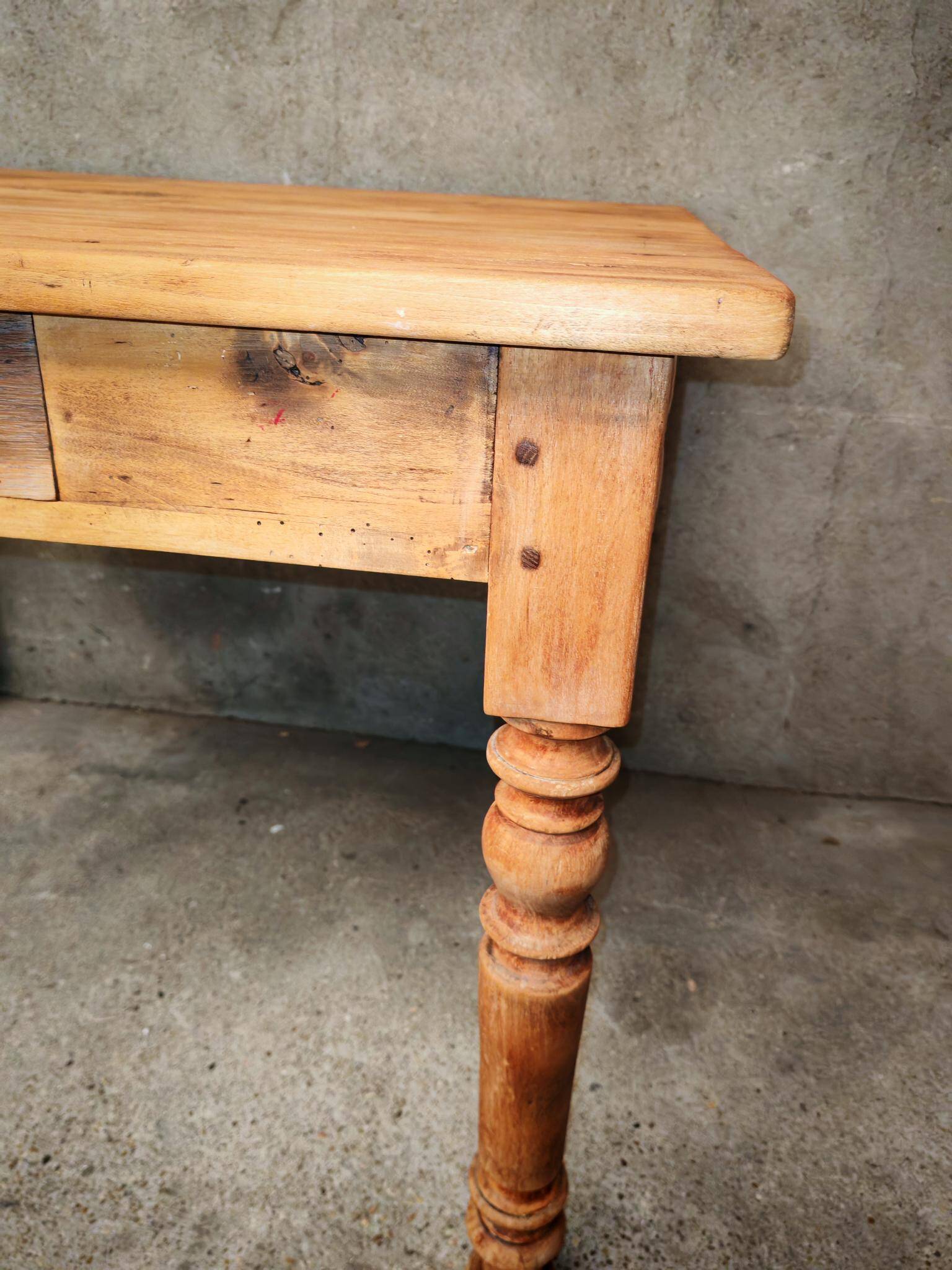 Small farmhouse table in light wood and tiled floors