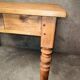 Small farmhouse table in light wood and tiled floors