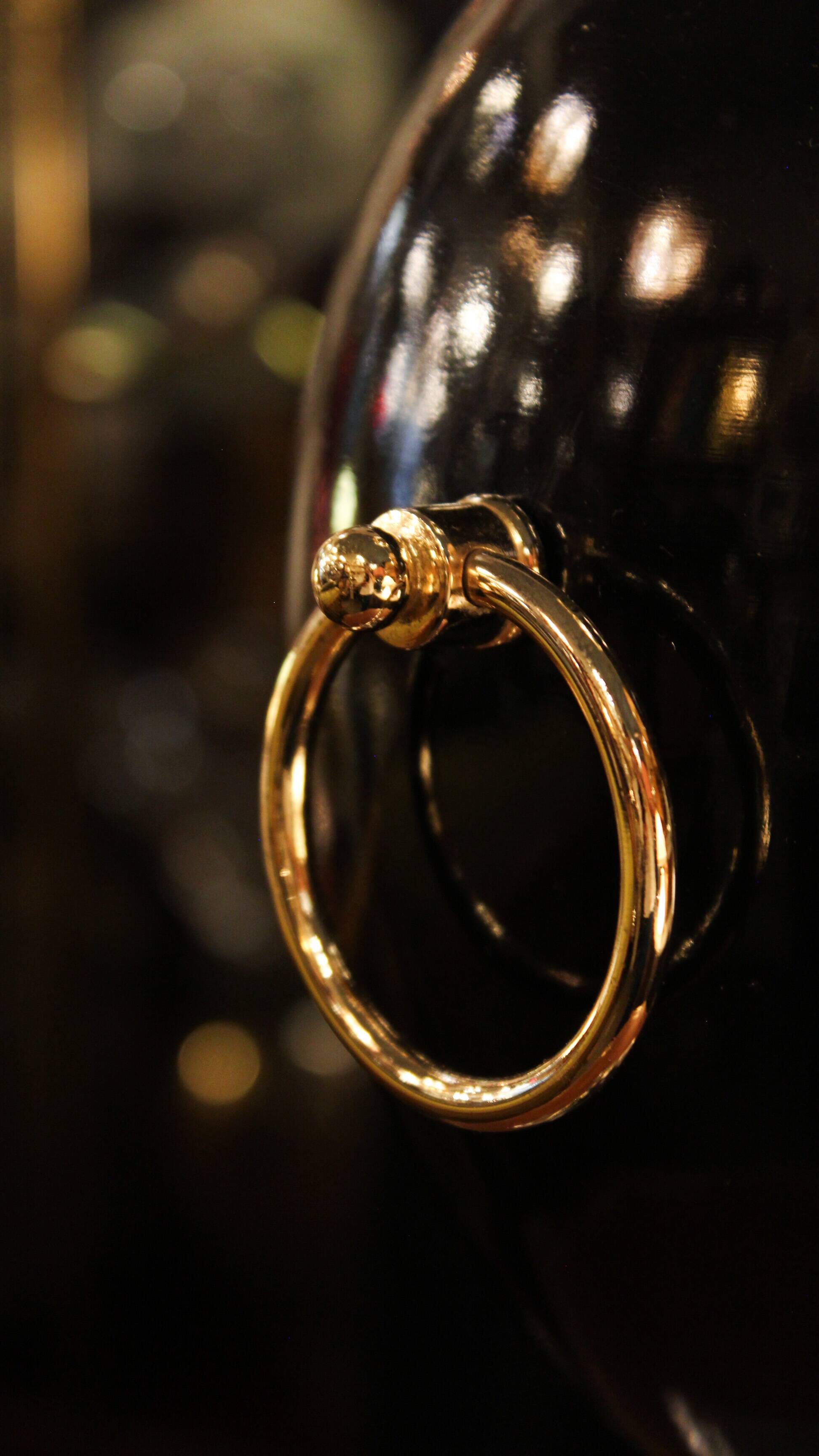 Black lamp in Hollywood Regency style