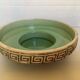 Green ceramic candle holder with a frieze