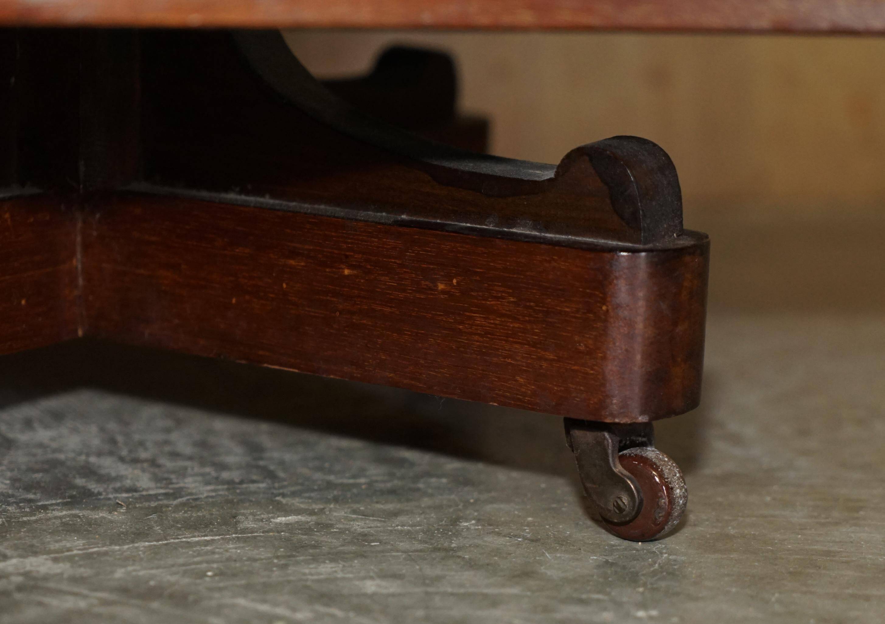 Restored Victorian walnut revolving library.
