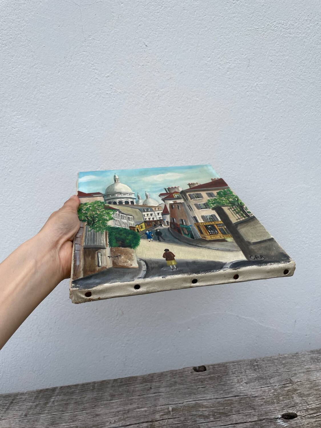 Old oil painting depicting a street in Montmartre