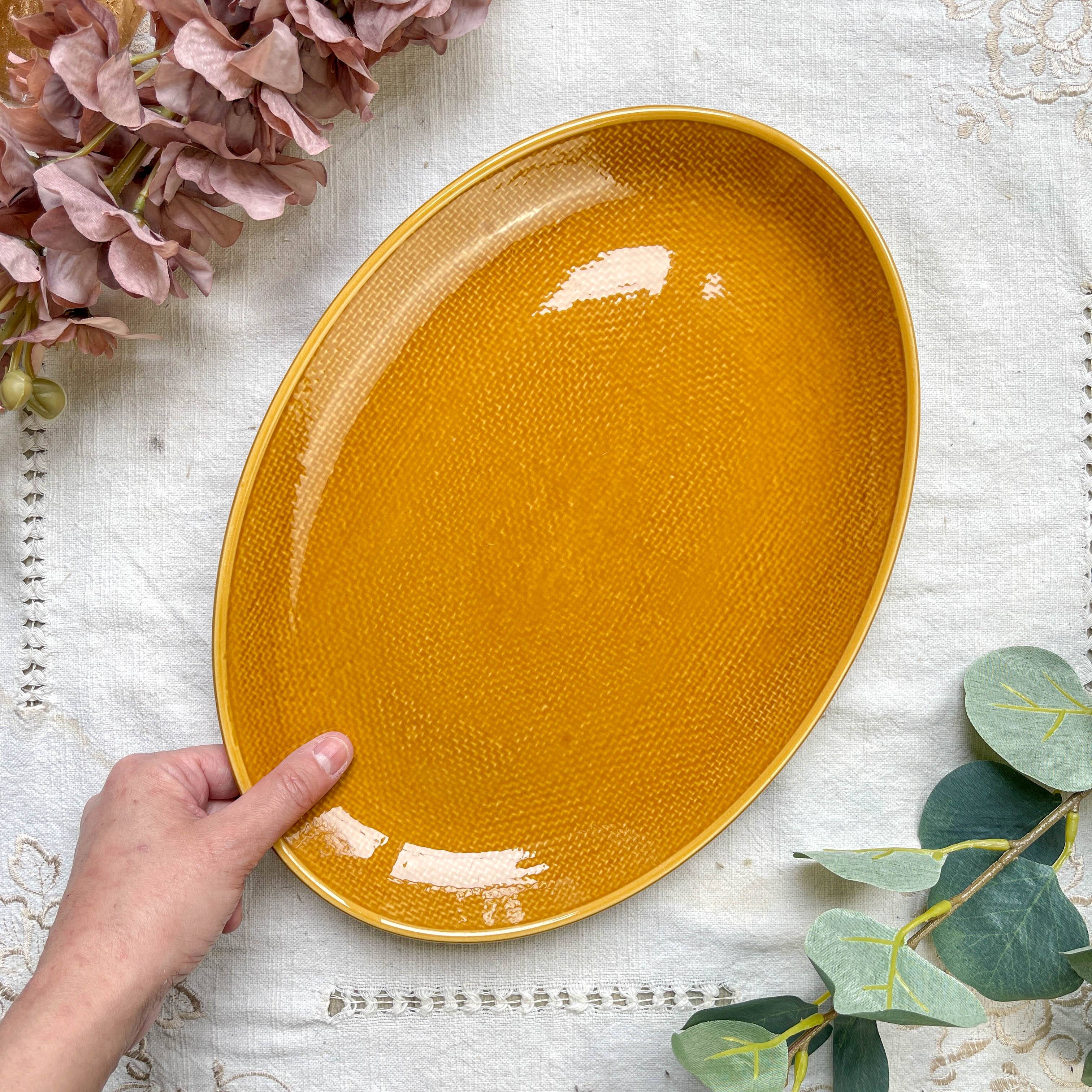 Vintage oval dish in ochre French earthenware from the 70s