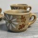 Set of 5 St Amand Autumn porcelain cups and saucers.