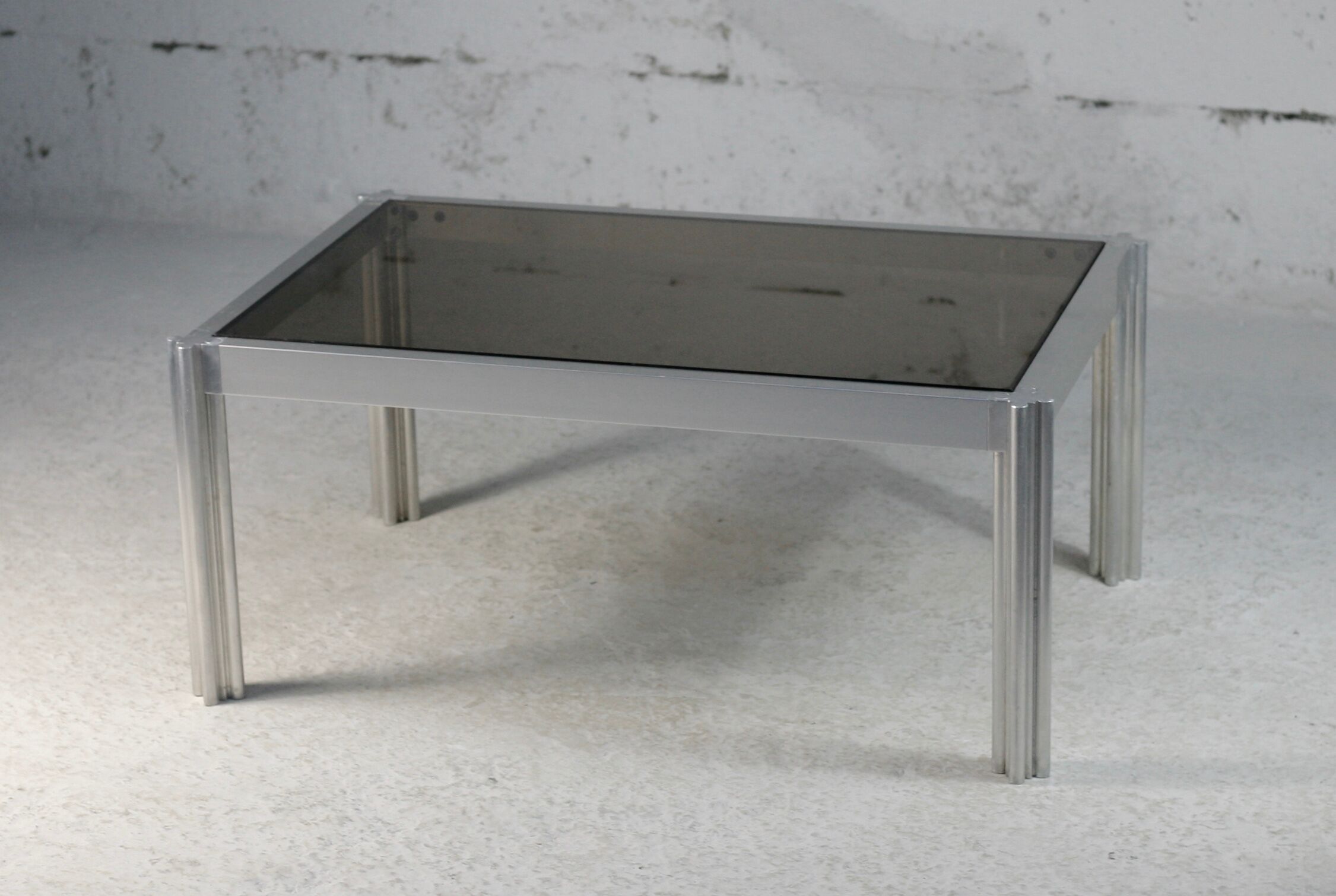 International Furniture. Steel coffee table and smoked glass. Circa 1970
