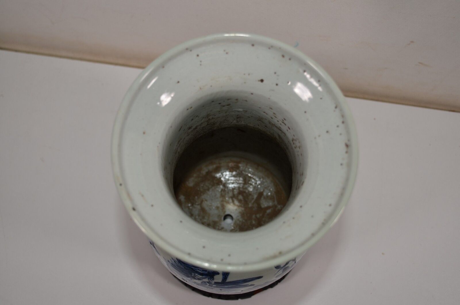 China. Porcelain mallet vase with blue and white phoenix decoration on a rock.