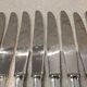 12 silver-plated table knives by Christofle America, 24.5cm