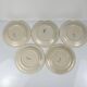Set de 5 assiettes à dessert Longwy, début XXème siècle, décor floral