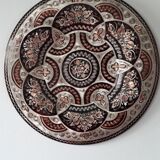 Oriental dish in chiseled red copper