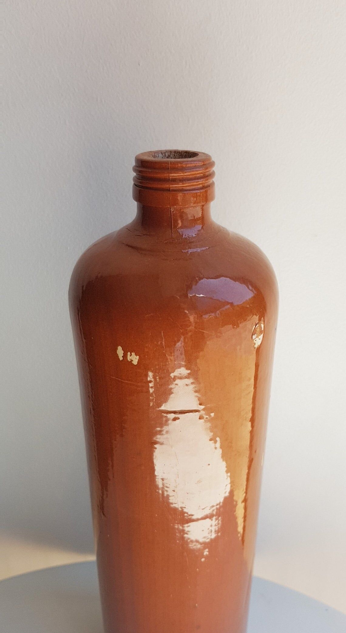 Enamelled sandstone bottle