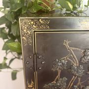 Magnificent black and gold lacquered Chinese cabinet.