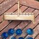 Blue shot glasses in baskets