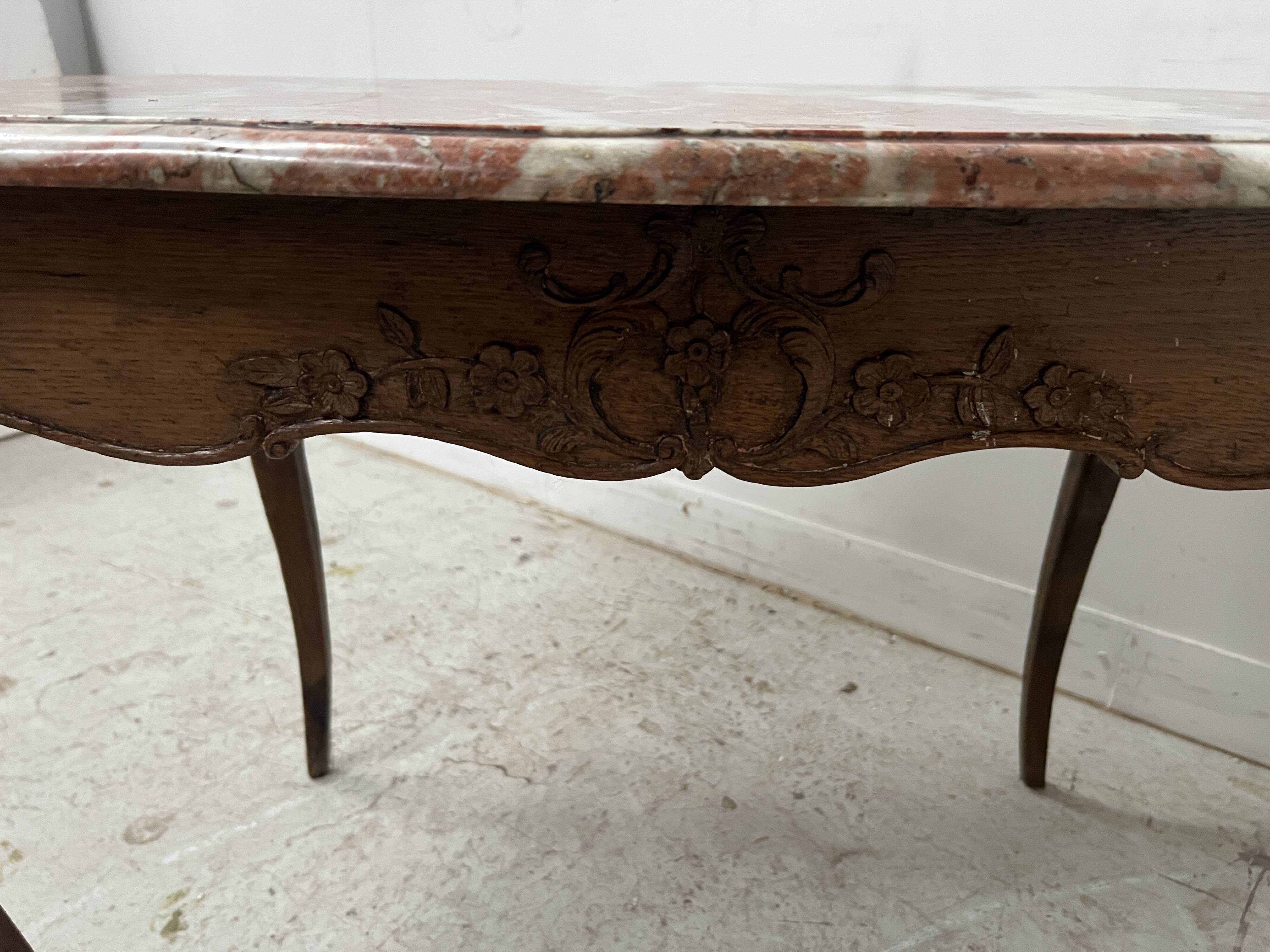 Louis XV mid-table in oak and marble, 18th century.