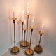 Gunnar Ander, four candlesticks, brass and glass, Ystad Metall, Swedish modern.