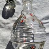 Carafe ancienne avec bouchon en verre et avec ses fleurs émaillées
