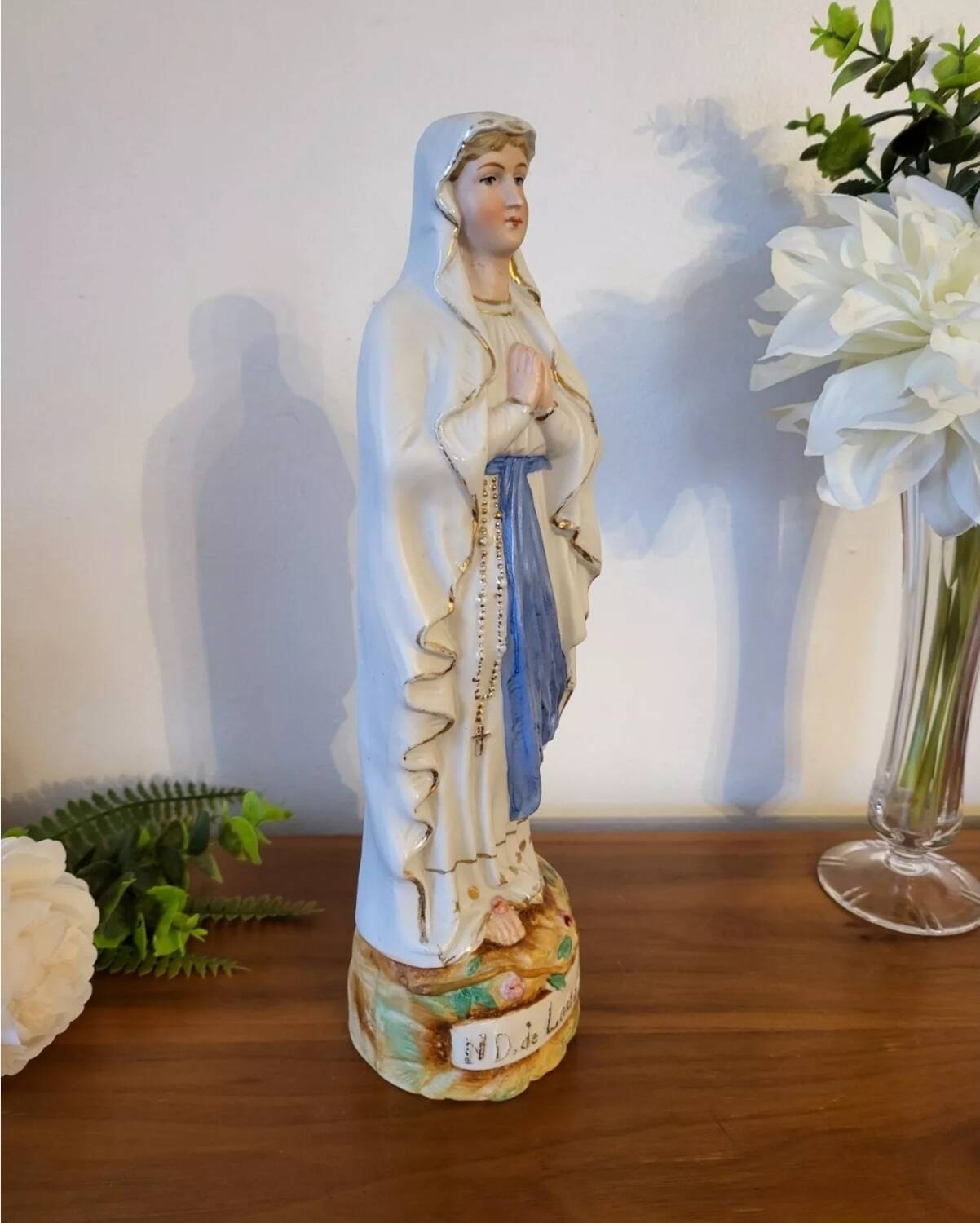 Religious statuette of the Virgin Mary in bisque porcelain