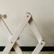 Vintage accordion coat rack in white painted wood