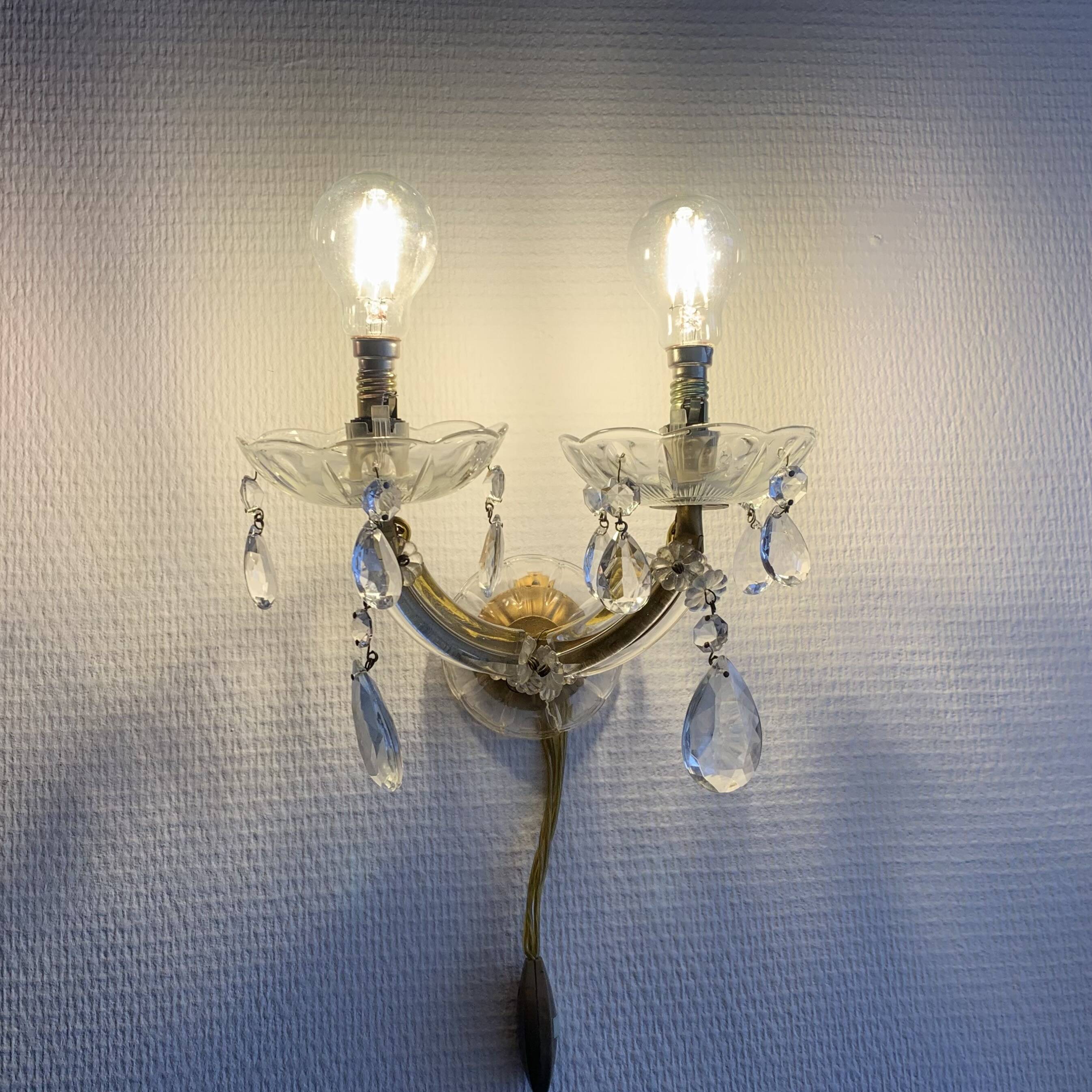 "Pair of vintage glass and brass wall sconces with tassels